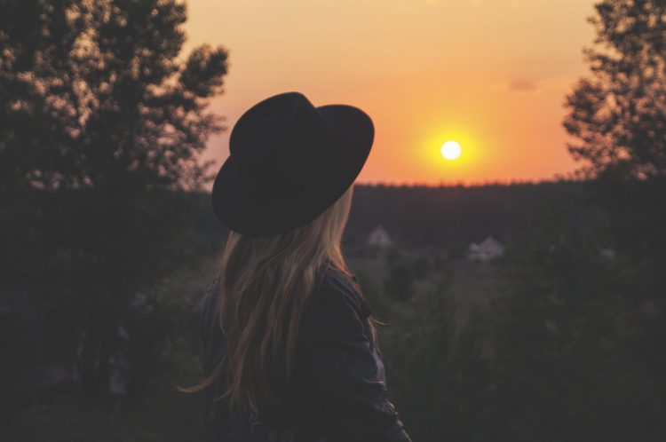 Woman watching sunset