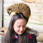 Meerkat on girls head