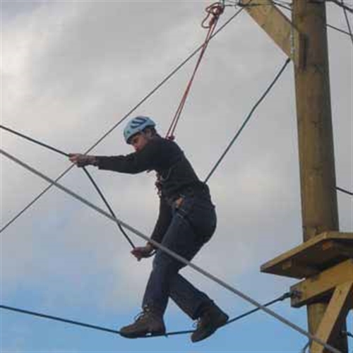 man walking a tightrope man walking a tightrope