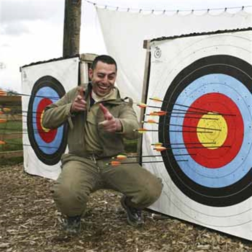 man having fun at archery man having fun at archery